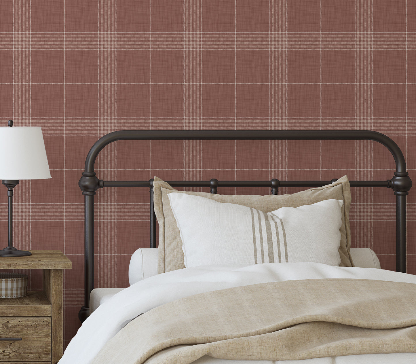 Bedroom with plaid wallpaper, wooden nightstand, and bed with pillows and blanket.