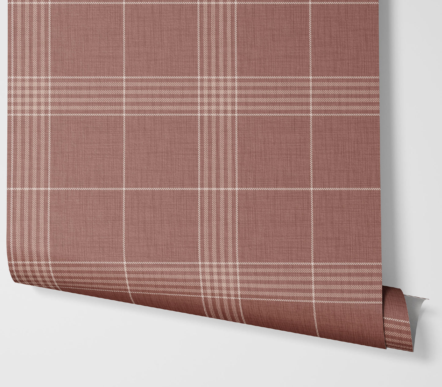 Roll of red plaid wallpaper on a white background